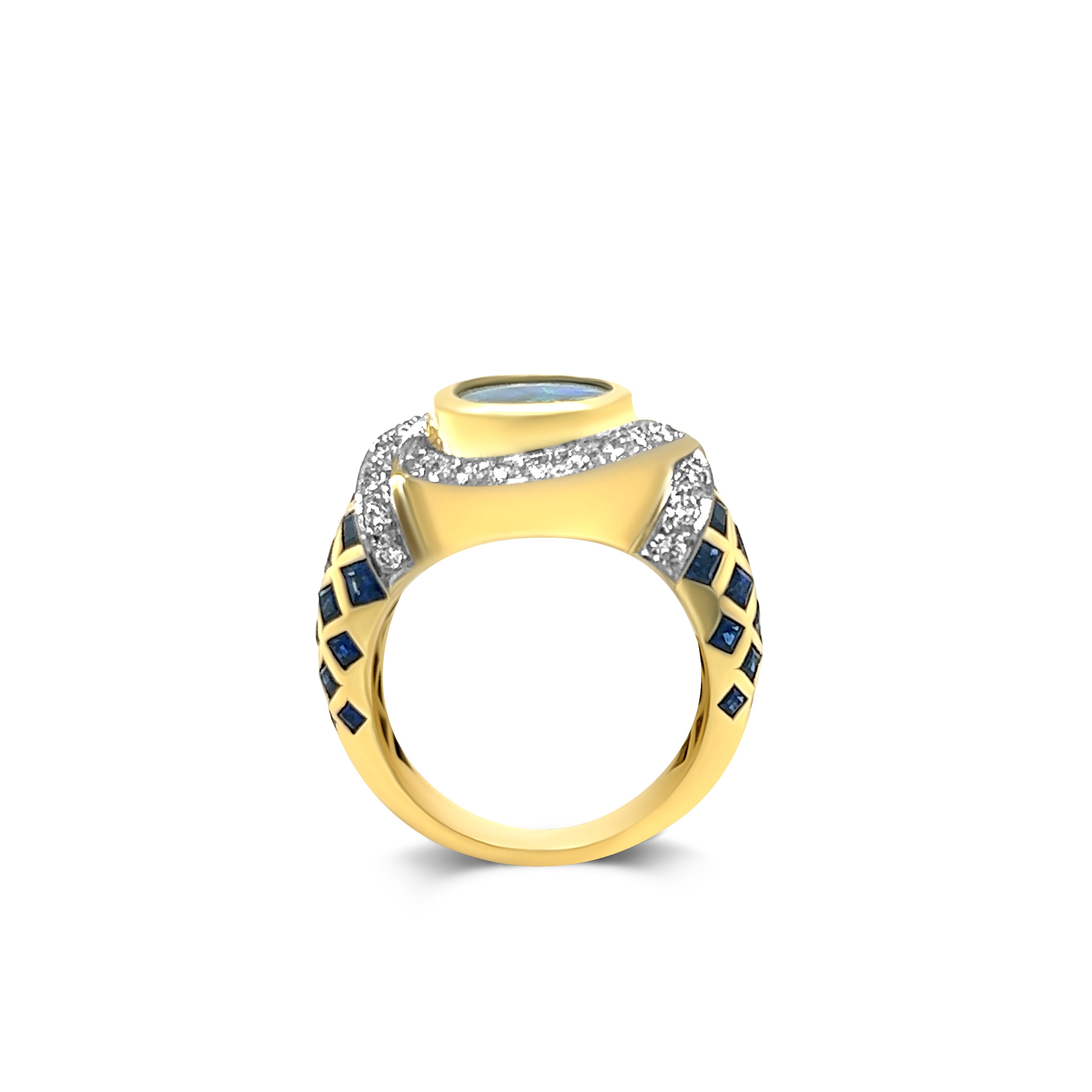 Profile view of 18kt yellow gold ring adorned with a captivating black opal, genuine 1.28ct sapphires, and sparkling 1.02ct diamonds. A symbol of timeless elegance and luxury jewelry craftsmanship.