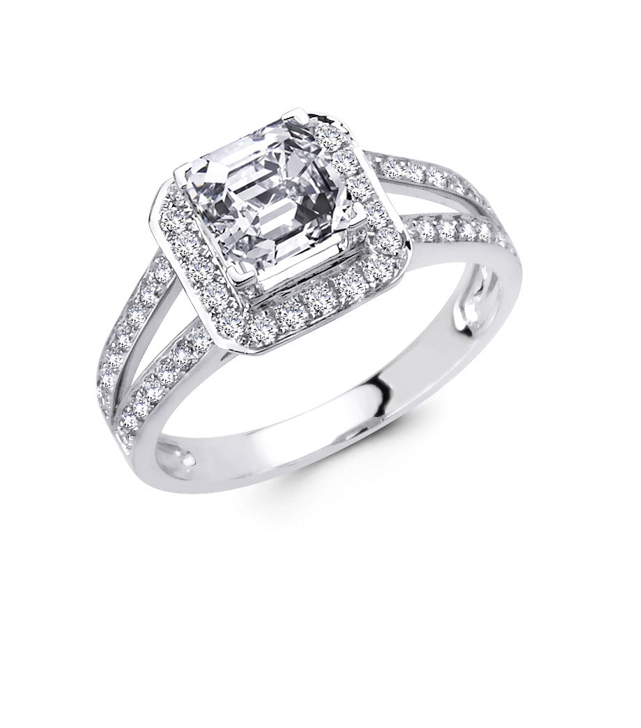 Asscher cut diamond halo engagement ring in 14kt white gold with round brilliant cut diamonds in a prong setting. Center stone is not included.