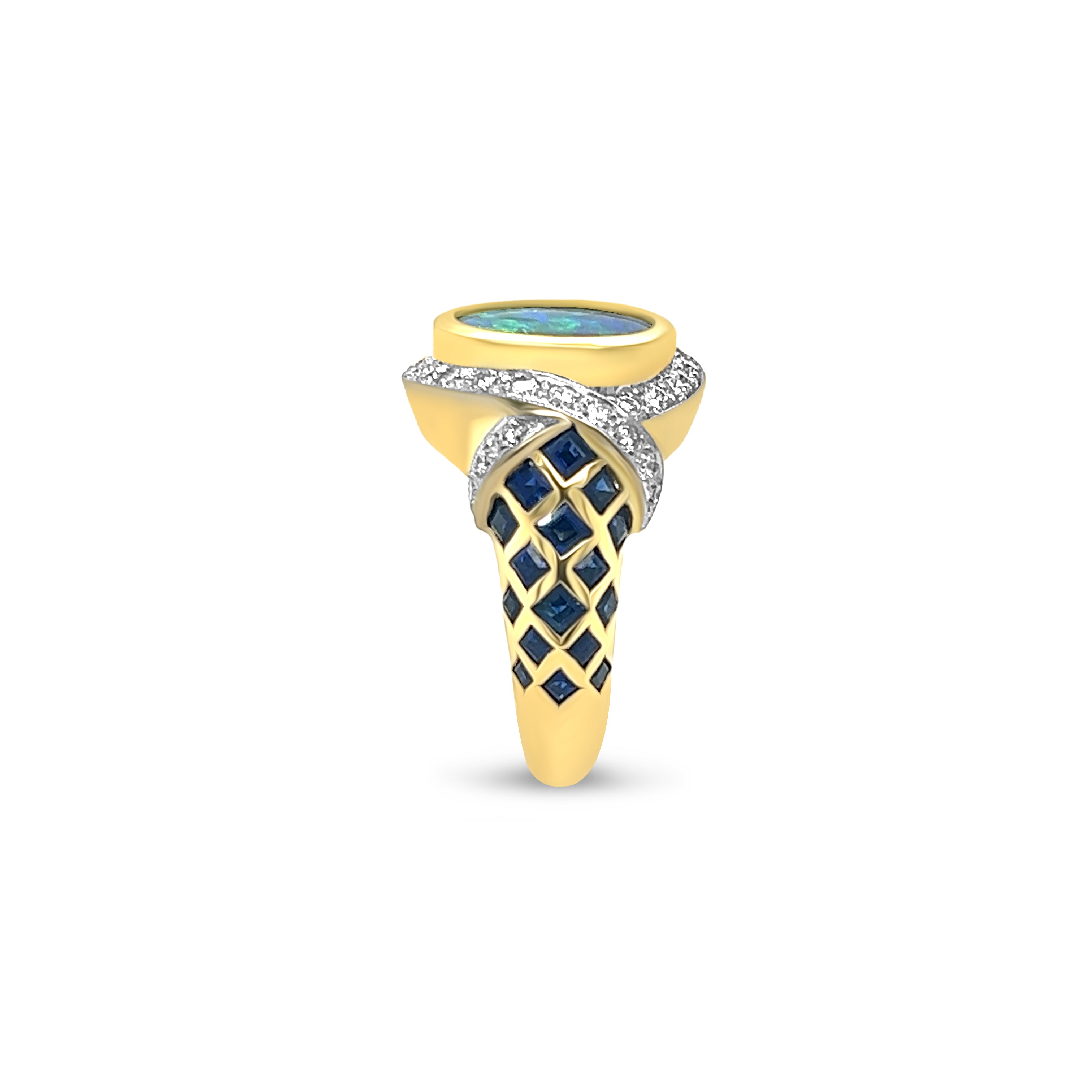 Side view of 18kt yellow gold ring adorned with a captivating black opal, genuine 1.28ct sapphires, and sparkling 1.02ct diamonds. A symbol of timeless elegance and luxury jewelry craftsmanship.
