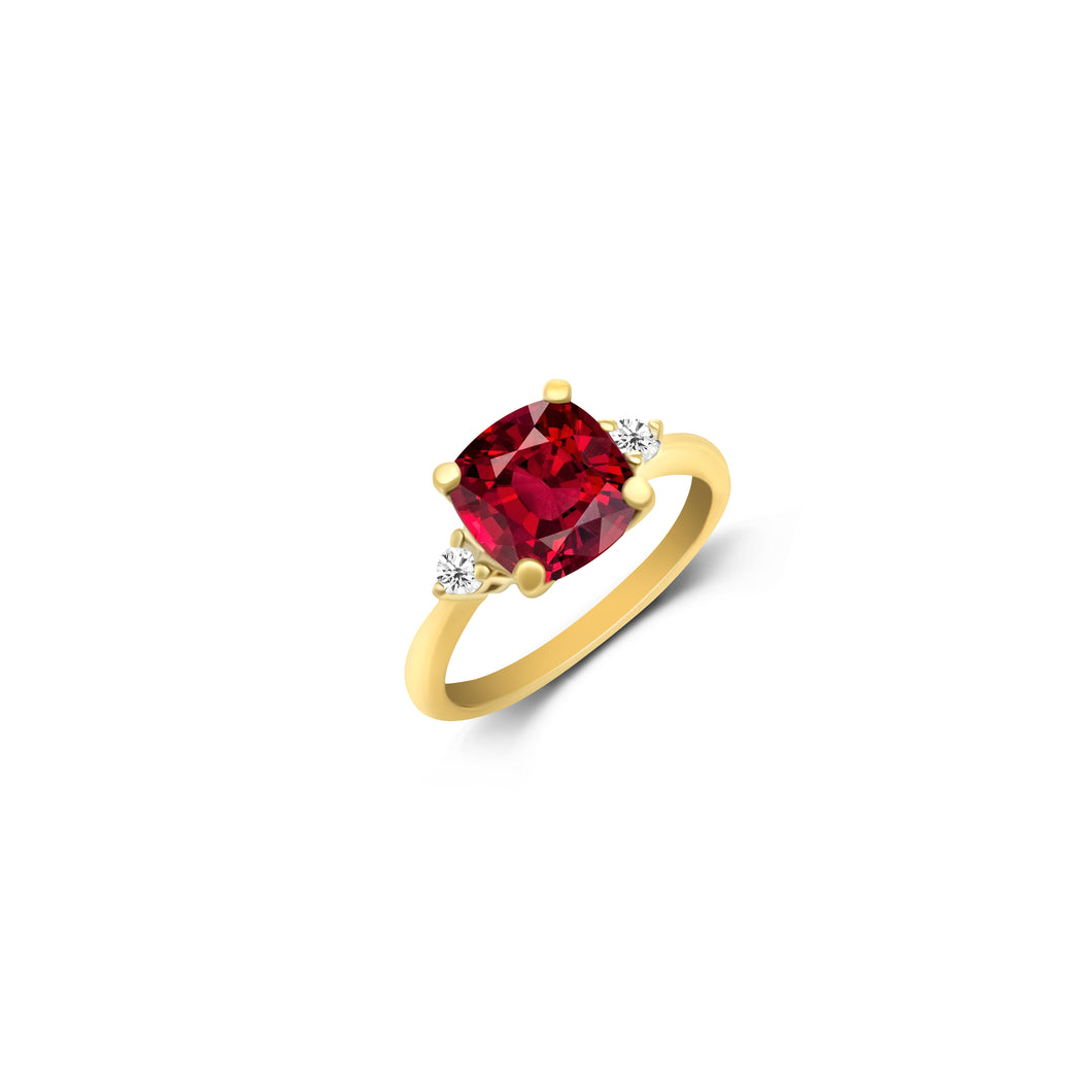 14KT Yellow gold ring features a genuine garnet gemstone at the center, accented by two round brilliant cut diamonds on each side. A perfect blend of sophistication and charm. 