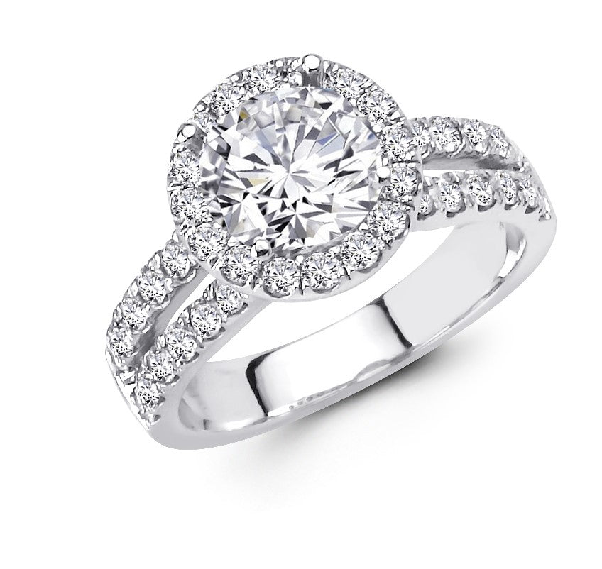 Unique 14kt white gold round diamond halo engagement ring with a split shank and side diamond heart design beneath a halo. 